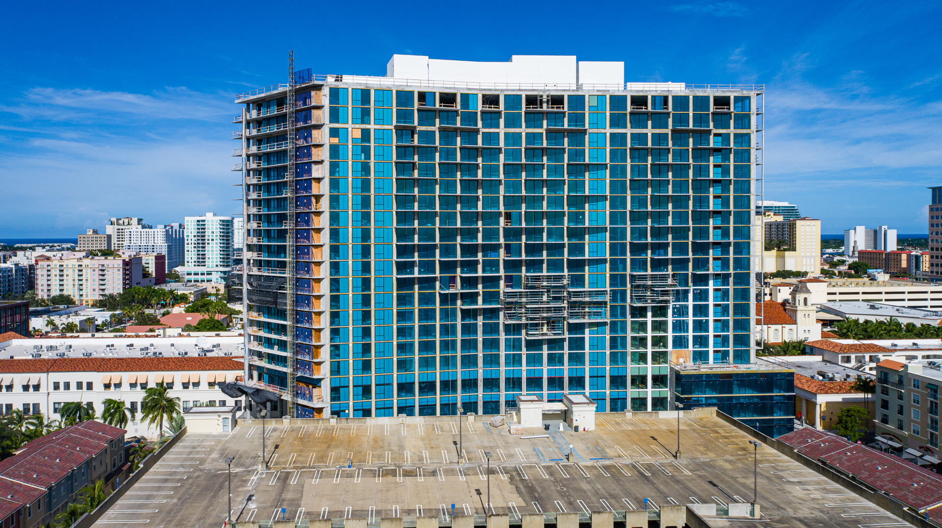 Glass curtain wall installation on a mid-rise tower