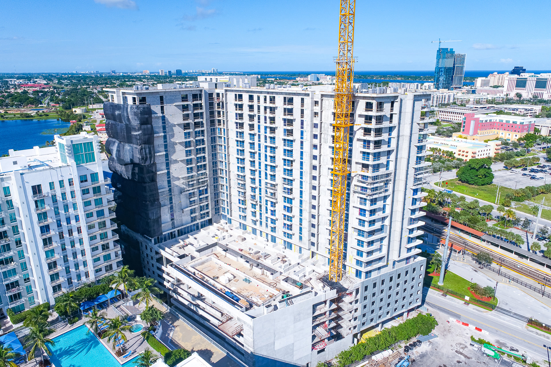 Podium construction phase surrounded by high-rises