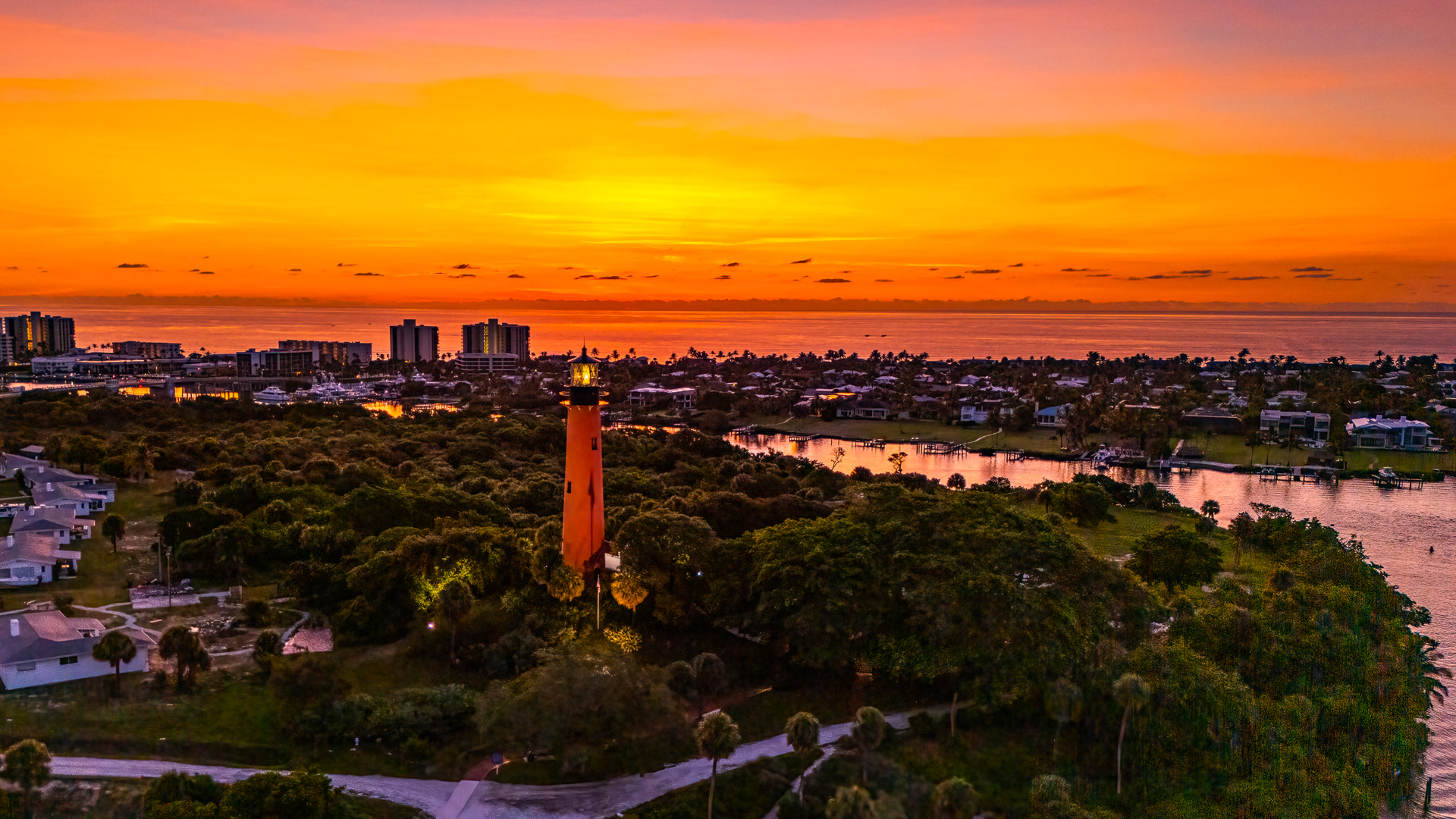 Jupiter Lighthouse glowing at dusk, photographed from the air