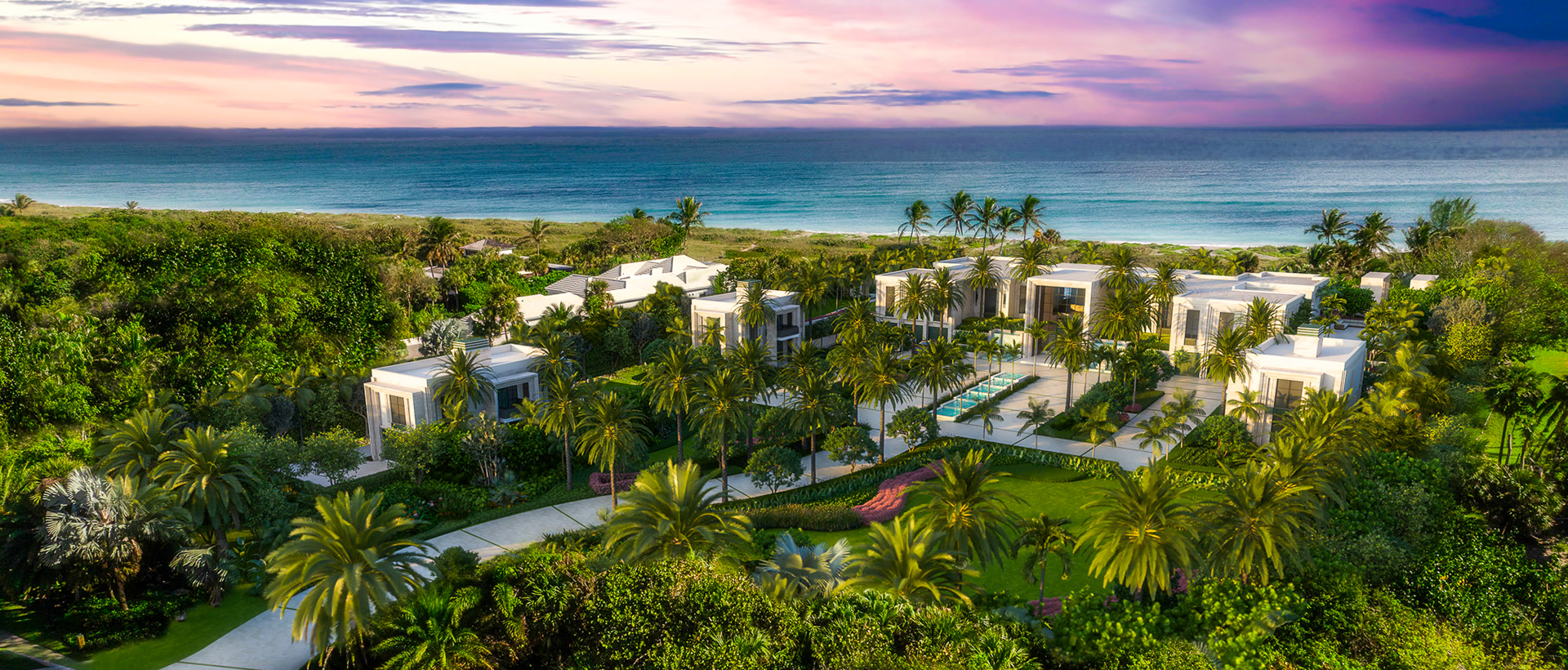 Aerial of beachfront villas beside the Atlantic