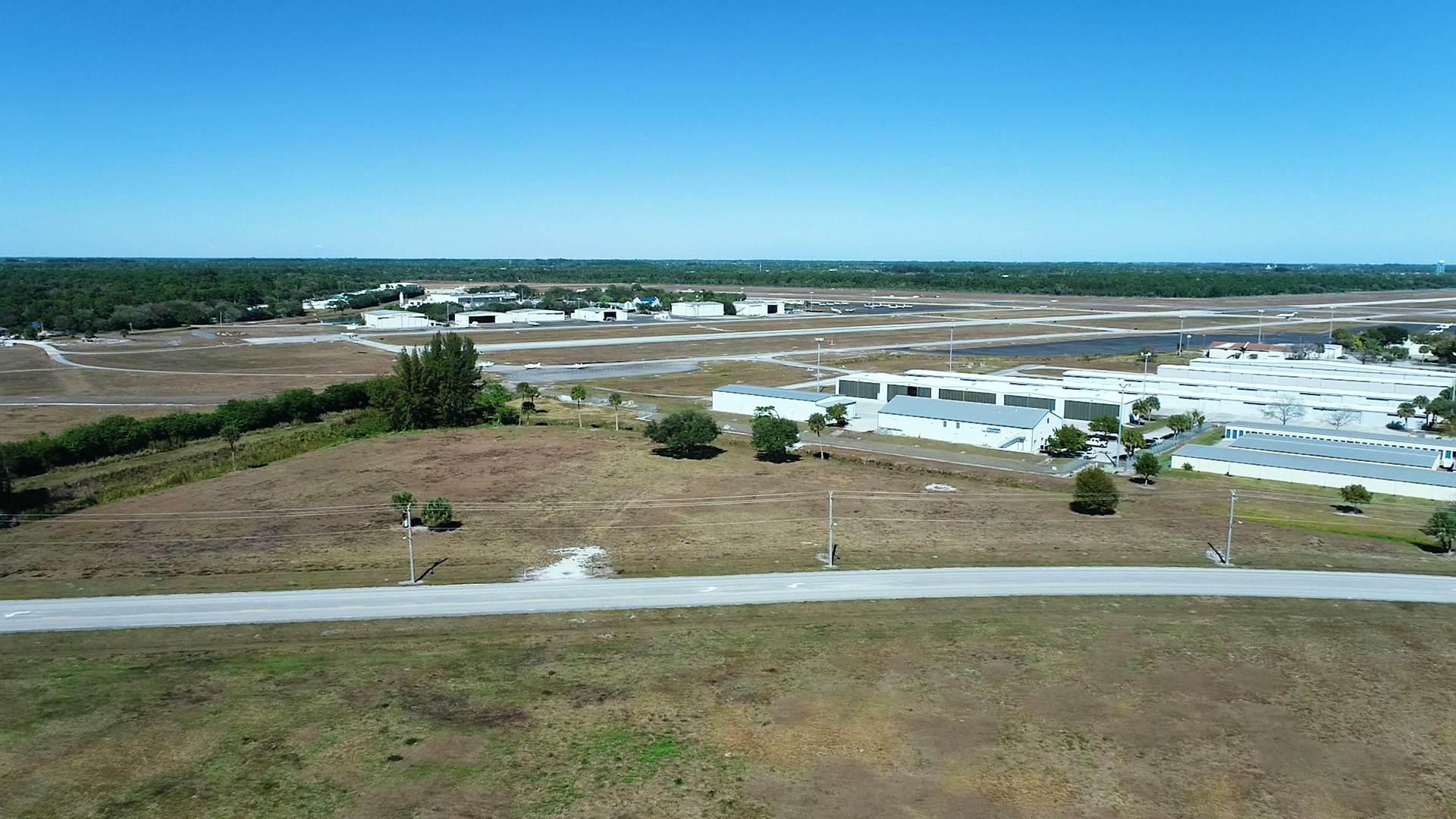 Aerial survey of an airport facility and hangars