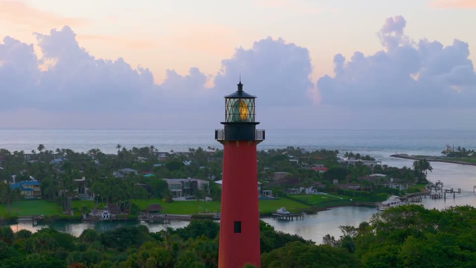 Video: slow aerial push toward the Jupiter Lighthouse at sunrise